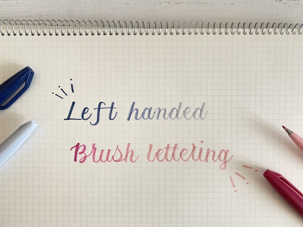 ノートに「left handed brush lettering」と書いている様子。